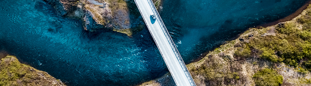 subscribe car driving traffic bridge river  